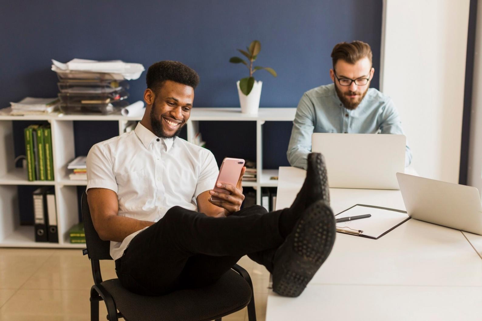Business meeting with financial documents and charts spread on table